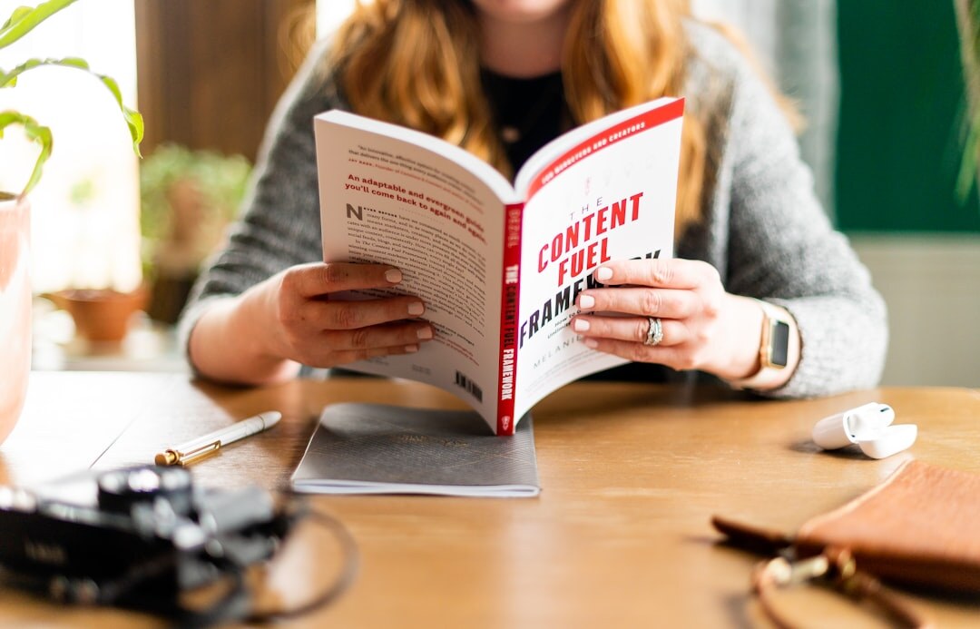 Journalist reading and annotating a press release document